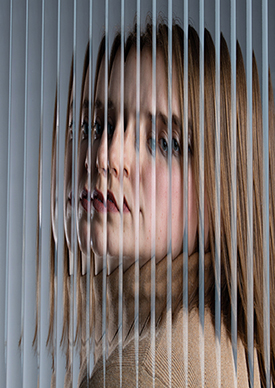 portrait taken through cabinet glass